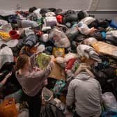 Volunteers at the Klub Orla Bialego (White Eagle Club) in Balham, south London, sift through donations made by members of the public. Picture: Aaron Chown/PA Wire