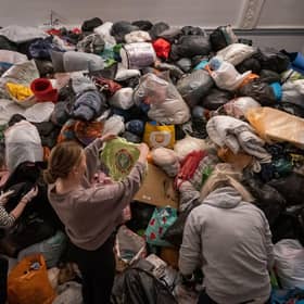 Volunteers at the Klub Orla Bialego (White Eagle Club) in Balham, south London, sift through donations made by members of the public. Picture: Aaron Chown/PA Wire
