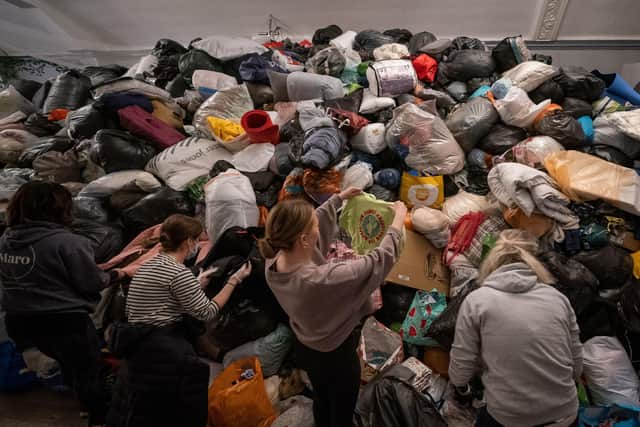 Volunteers at the Klub Orla Bialego (White Eagle Club) in Balham, south London, sift through donations made by members of the public. Picture: Aaron Chown/PA Wire