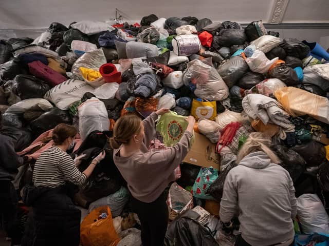 Volunteers at the Klub Orla Bialego (White Eagle Club) in Balham, south London, sift through donations made by members of the public. Picture: Aaron Chown/PA Wire