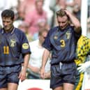 John Collins (left) and Tom Boyd hang their heads as Scotland head for defeat against the 'Auld Enemy'.