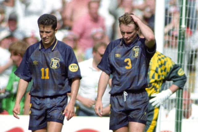 John Collins (left) and Tom Boyd hang their heads as Scotland head for defeat against the 'Auld Enemy'.