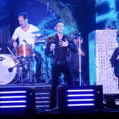 CHICAGO - AUGUST 09: Ronnie Vannucci Jr., Brandon Flowers and Mark Stoermer of The Killers perform during the 2009 Lollapalooza music festival at Grant Park on August 9, 2009 in Chicago, Illinois. (Photo by Jeff Gentner/Getty Images)