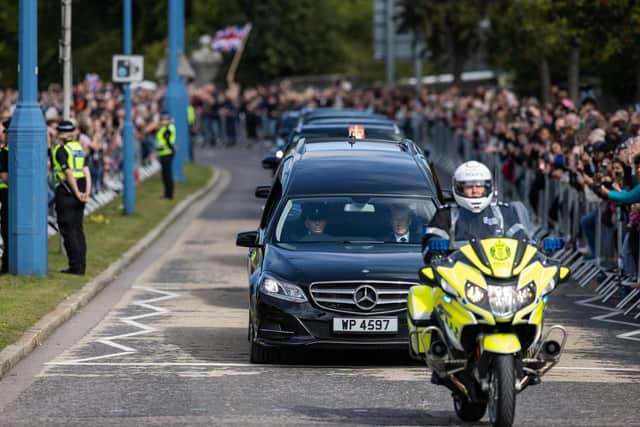The hearse and the cortege pass through Aberdeen. Picture: Paul Campbell/PA Wire