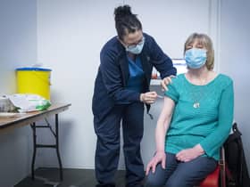 Nurse Sarah MacLeod, from the Vaccination Team, gives Margaret Swift, aged 69, from Balgreen, Edinburgh, her vaccine at the coronavirus mass vaccine centre at the Edinburgh International Conference Centre. Picture date: Monday February 1, 2021.