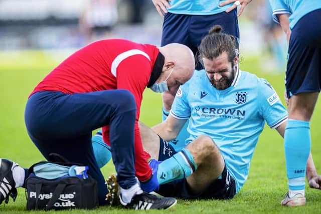 Cillian Sheridan is forced off with an injury during a Cinch Premiership match between St Mirren and Dundee, on October 30, in Paisley, Scotland. (Photo by Roddy Scott / SNS Group)