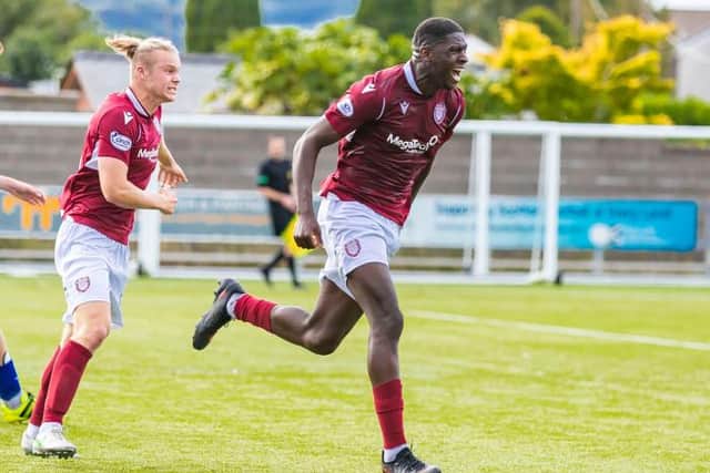 Arbroath's Joel Nouble scores to make it 0-2 during the cinch Championship match between Queen of the South and Arbroath at Palmerston in September. (Photo by Roddy Scott / SNS Group)