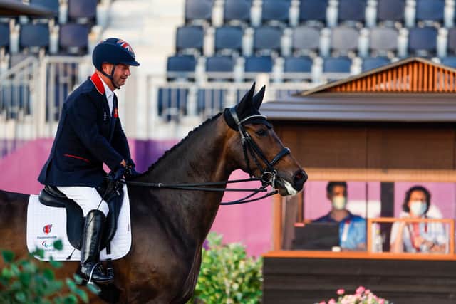 Lee Pearson of Great Britain competes with his horse Breezer in the Dressage Individual Test Grade II en route to winning gold. (Photo by Tasos Katopodis / Getty Images)