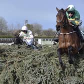 Rachael Blackmore riding Minella Times clears the last fence to win the Randox Grand National Handicap Chase in 2021. Photo: Peter Powell/Pool via AP, File.