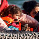 Children in a small boat in the English Channel are rescued after their vessel's engine broke down (Picture: Sameer al-Doumy/AFP via Getty Images)