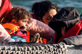 Children in a small boat in the English Channel are rescued after their vessel's engine broke down (Picture: Sameer al-Doumy/AFP via Getty Images)