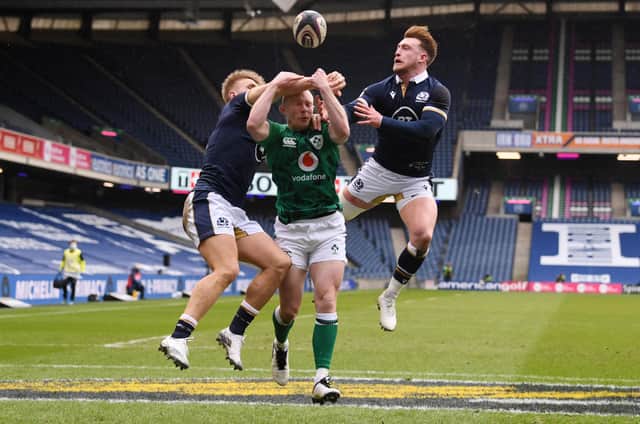 Keith Earls of Ireland competes for the ball with (L - R) Chris Harris and Stuart Hogg of Scotland leading to the first try scored by Robbie Henshaw (Not pictured) during the Guinness Six Nations match between Scotland and Ireland at Murrayfield on March 14, 2021 in Edinburgh, Scotland. Sporting stadiums around the UK remain under strict restrictions due to the Coronavirus Pandemic as Government social distancing laws prohibit fans inside venues resulting in games being played behind closed doors. (Photo by Stu Forster/Getty Images)
