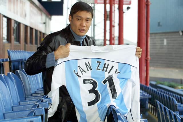 Chinese Internationalist Fan Zhiyi signs for Dundee in November 2001.