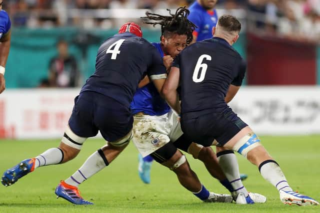 New Glasgow signing TJ Ioane is tackled by Grant Gilchrist and Magnus Bradbury during the Samoa v Scotland match at last year's Rugby World Cup.