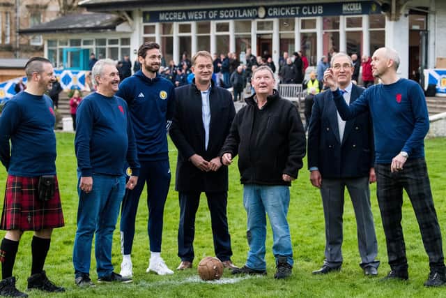 SFA chief executive Ian Maxwell (centre) watches the Ceremonial Coin Toss during an event to mark the 150th anniversary of the first Scotland v England international fixture in 1872, which took place at the West of Scotland Cricket Ground  (Photo by Ross Parker / SNS Group)
