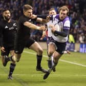 Scotland's Stuart Hogg (right) is tackled by the All Blacks' Beauden Barrett late in the 2017 Murrayfield game to be denied a try