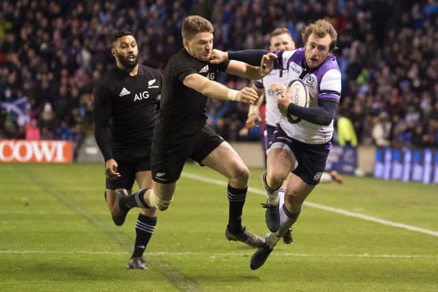 Scotland's Stuart Hogg (right) is tackled by the All Blacks' Beauden Barrett late in the 2017 Murrayfield game to be denied a try