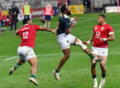 South African captain Lukhanyo Am grabs the ball ahead of Bundee Aki and Anthony Watson.