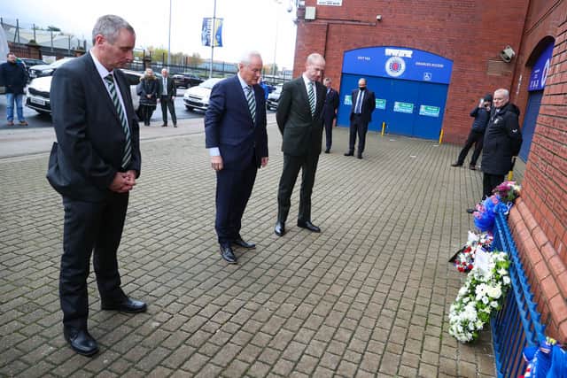 Celtic chairman Ian Bankier (centre) lays a wreath in memory of Walter Smith alongside chief executive Michael Nicholson and Tom Boyd. (Photo by Alan Harvey / SNS Group)