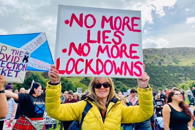 Anti-mask demonstrator taking part in a march outside Holyrood, Edinburgh