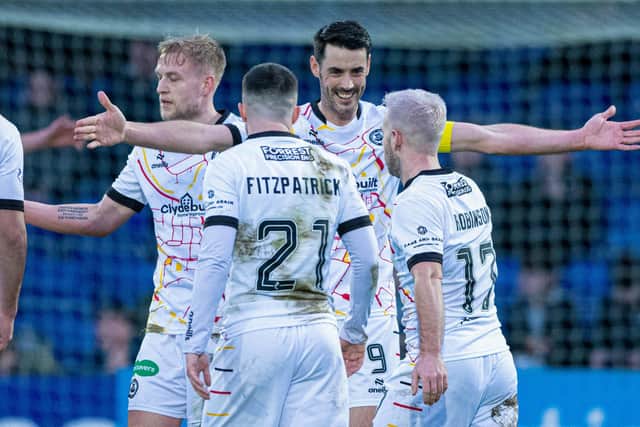 Partick's Brian Graham celebrates with his team-mates after scoring against Ross County. (Photo by Paul Devlin / SNS Group)