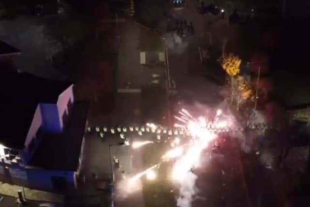 Police officers are targeted with fireworks in Niddrie, Edinburgh, during chaotic scenes on Bonfire Night