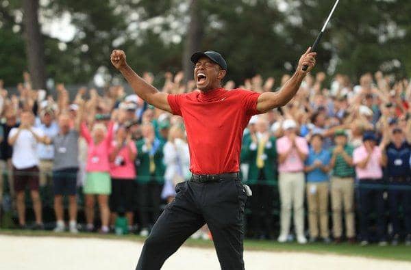 Tiger Woods celebrates on the 18th green after winning the Masters in 2019. (Photo by Andrew Redington/Getty Images)