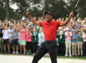 Tiger Woods celebrates on the 18th green after winning the Masters in 2019. (Photo by Andrew Redington/Getty Images)