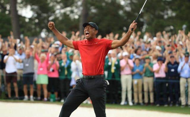 Tiger Woods celebrates on the 18th green after winning the Masters in 2019. (Photo by Andrew Redington/Getty Images)