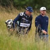 Connor Syme walks alongside his caddie, Ryan McGuigan during day one of the Genesis Scottish Open at The Renaissance Club. Picture: Andrew Redington/Getty Images.