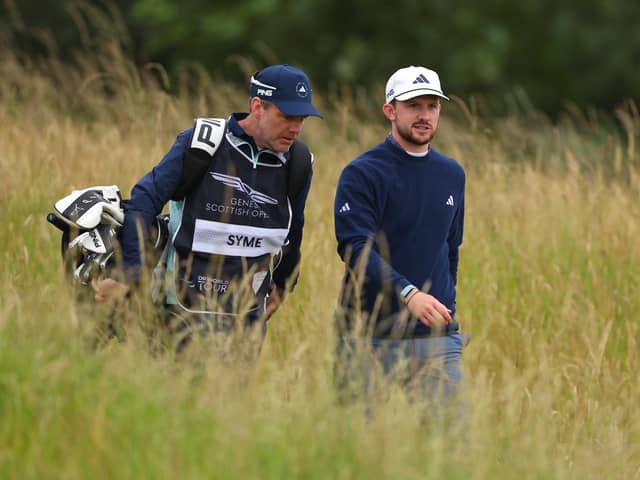 Connor Syme walks alongside his caddie, Ryan McGuigan during day one of the Genesis Scottish Open at The Renaissance Club. Picture: Andrew Redington/Getty Images.