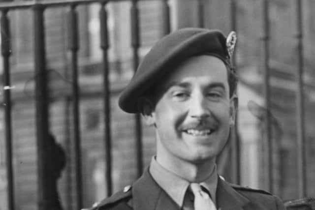 Lieutenant-Colonel Simon Fraser, the 15th Lord Lovat, following his investiture in 1942. He received the Distinguished Service Order and Military Cross from George VI. (Photo by M. McNeill/Fox Photos/Hulton Archive/Getty Images)