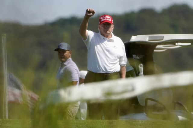 Former US president Donald Trump gestures while playing golf at Trump National Golf Club in Sterling. Picture: AP Photo/Manuel Balce Ceneta