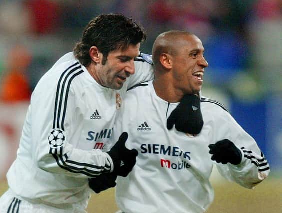 Lui Figo and Roberto Carlos will be team-mates again at Ibrox next year (Photo by PIERRE-PHILIPPE MARCOU/AFP via Getty Images)
