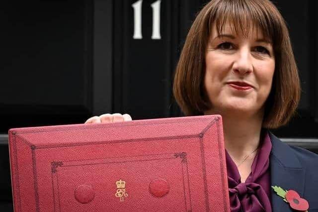 Rachel Reeves poses with the red Budget Box outside Downing Street ahead of this year’s Autumn budget to Parliament 