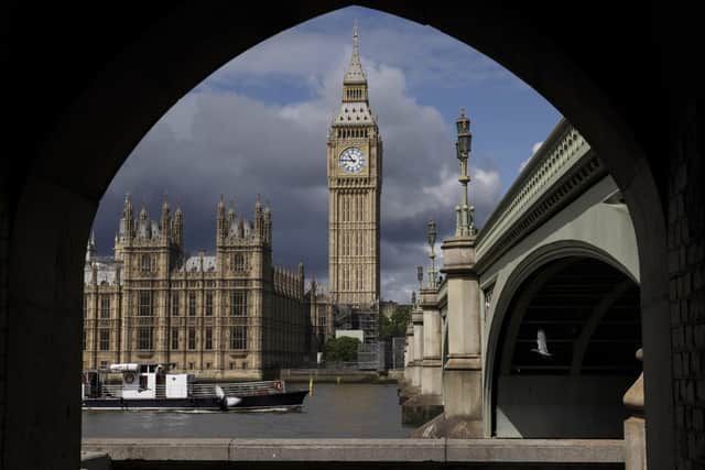 Storm clouds move over the Houses of Parliament in Westminster. Photo by Dan Kitwood/Getty