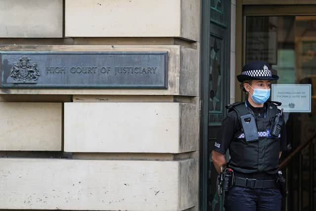 A police officer outside the Edinburgh High Court ahead of a hearing in the M9 death crash case in September. Police Scotland has pleaded guilty to failings which "materially contributed" to the death of Lamara Bell, 25, following the crash on the M9.