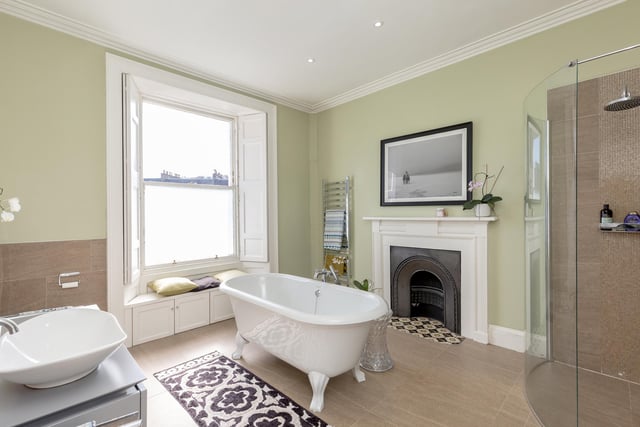 The elegant family bathroom is well appointed and features a free-standing bath