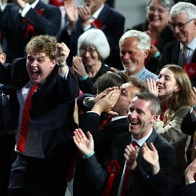 Labour supporters celebrate as exit polls predict the party's landslide election win (Picture: Jeff J Mitchell/Getty Images)
