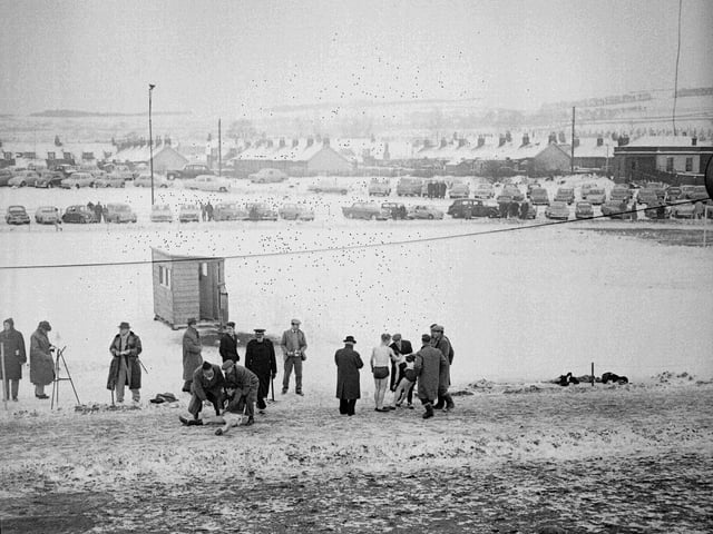 The traditional New Year Sprint at Newtongrange goes on despite snow in 1959, where the winner and runner-up in the youth mile race required assistance after collapsing in the cold.