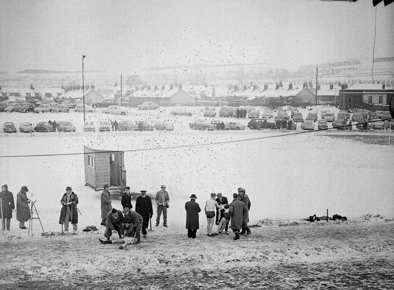 The traditional New Year Sprint at Newtongrange goes on despite snow in 1959, where the winner and runner-up in the youth mile race required assistance after collapsing in the cold.