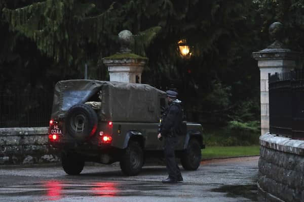 Police check a Land Rover driving into Balmoral in Scotland. Picture: AP Photo/Scott Heppell