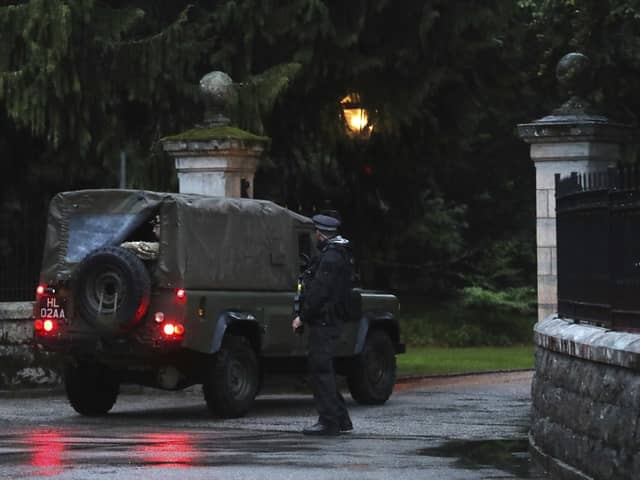 Police check a Land Rover driving into Balmoral in Scotland. Picture: AP Photo/Scott Heppell