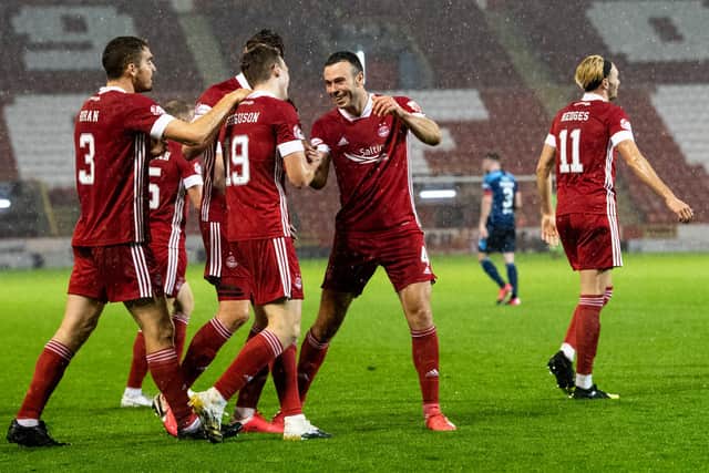 The Aberdeen players celebrate Lewis Ferguson's rocket. Picture: SNS