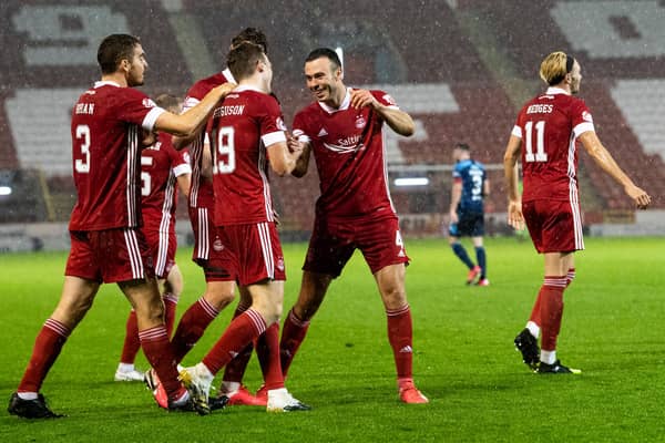 The Aberdeen players celebrate Lewis Ferguson's rocket. Picture: SNS
