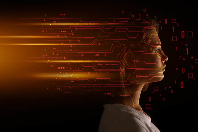 Portrait of young woman on dark background. Concept of computer science (Picture: stock.adobe.com)
