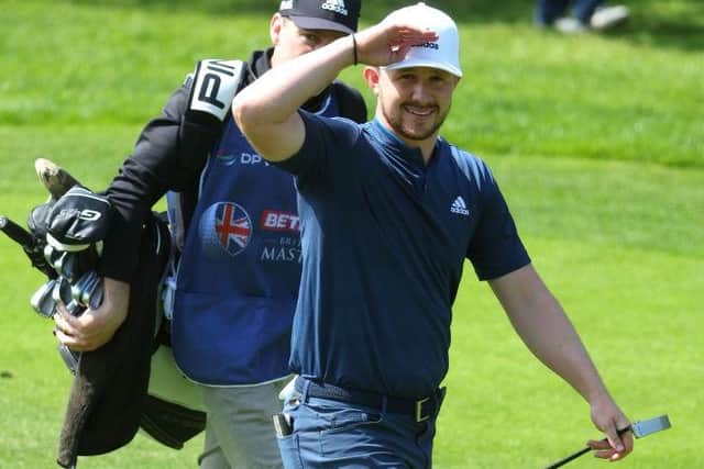 Connor Syme salutes walking off the first tee in the final round of the Betfred British Masters. Picture: Andrew Redington/Getty Images.