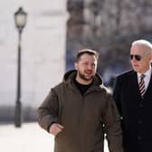 Joe Biden walks next to Ukrainian President Volodymyr Zelensky as he arrives for a visit in Kyiv on February 20, 2023. Photo by DIMITAR DILKOFF/AFP via Getty Images