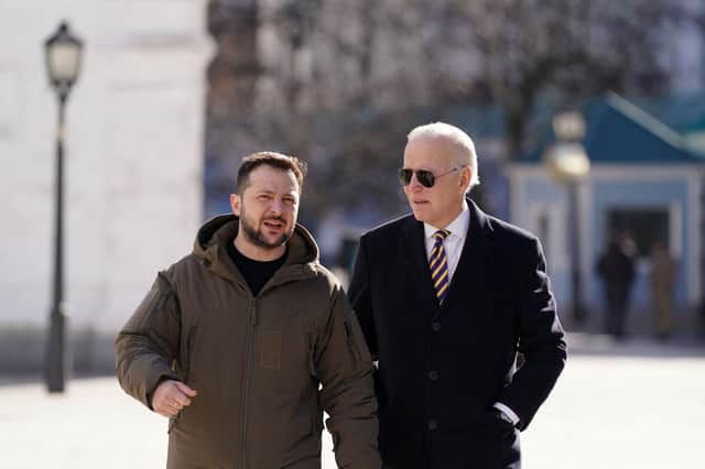 Joe Biden walks next to Ukrainian President Volodymyr Zelensky as he arrives for a visit in Kyiv on February 20, 2023. Photo by DIMITAR DILKOFF/AFP via Getty Images