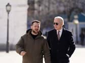 Joe Biden walks next to Ukrainian President Volodymyr Zelensky as he arrives for a visit in Kyiv on February 20, 2023. Photo by DIMITAR DILKOFF/AFP via Getty Images